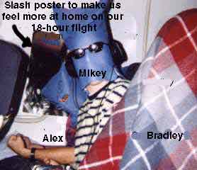 alex, poster of slash, mikey, and bradley on the plane